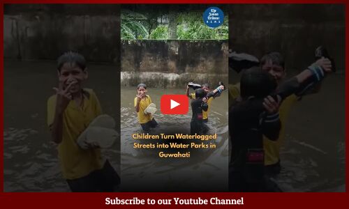 Children Turn Waterlogged Streets into Water Parks in Guwahati
